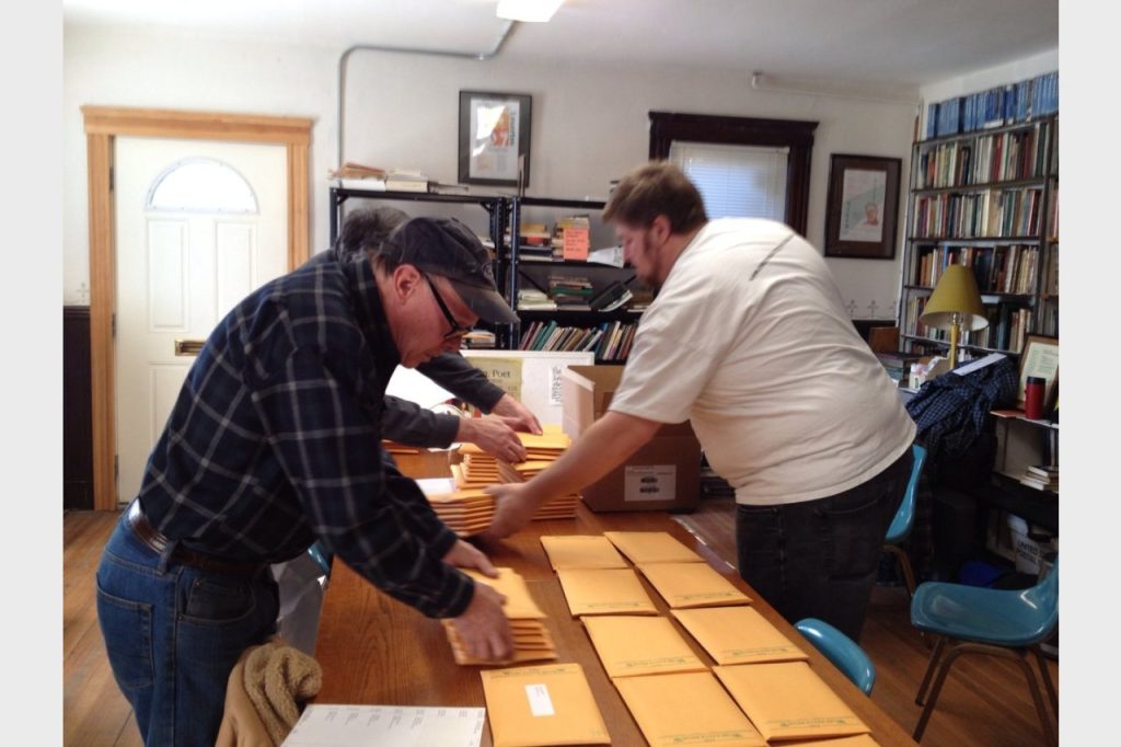 Robert Steele (left) coordinated the mailing process. Photo by: Kristina England